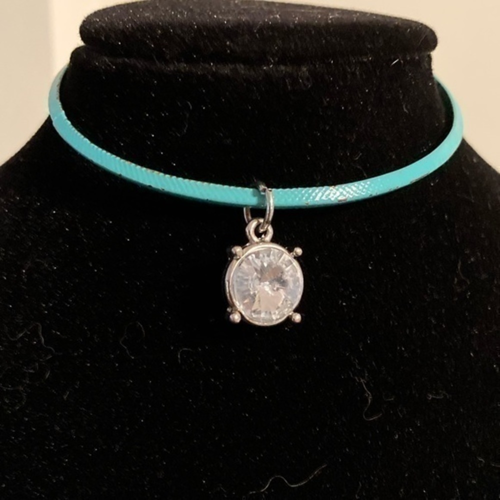 Green bangle bracelet with shiny rhinestone charm